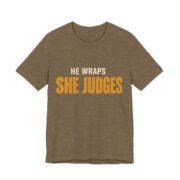 He Wraps. She Judges Shirt - Bold - Funny Christmas Tee in Heather Olive