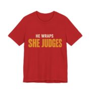 He Wraps. She Judges Shirt - Bold - Funny Christmas Tee in Red